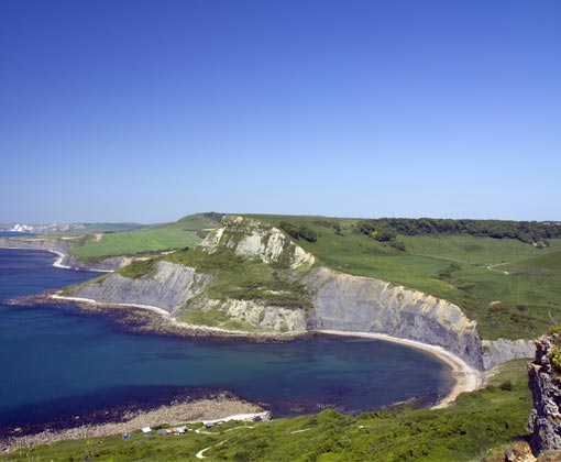 Walking Adventures: Explore Dorset’s Scenic Trails - the photograph shows Worbarrow Bay which is found a short walk (1 mile or 20 minutes) from Tyneham village or via the South West Coast Path from Lulworth Cove or Kimmeridge