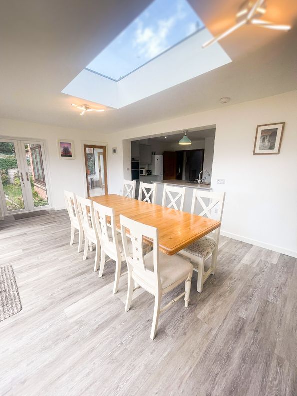 Betula House Image of the dining table area looking towards the kitchen work area